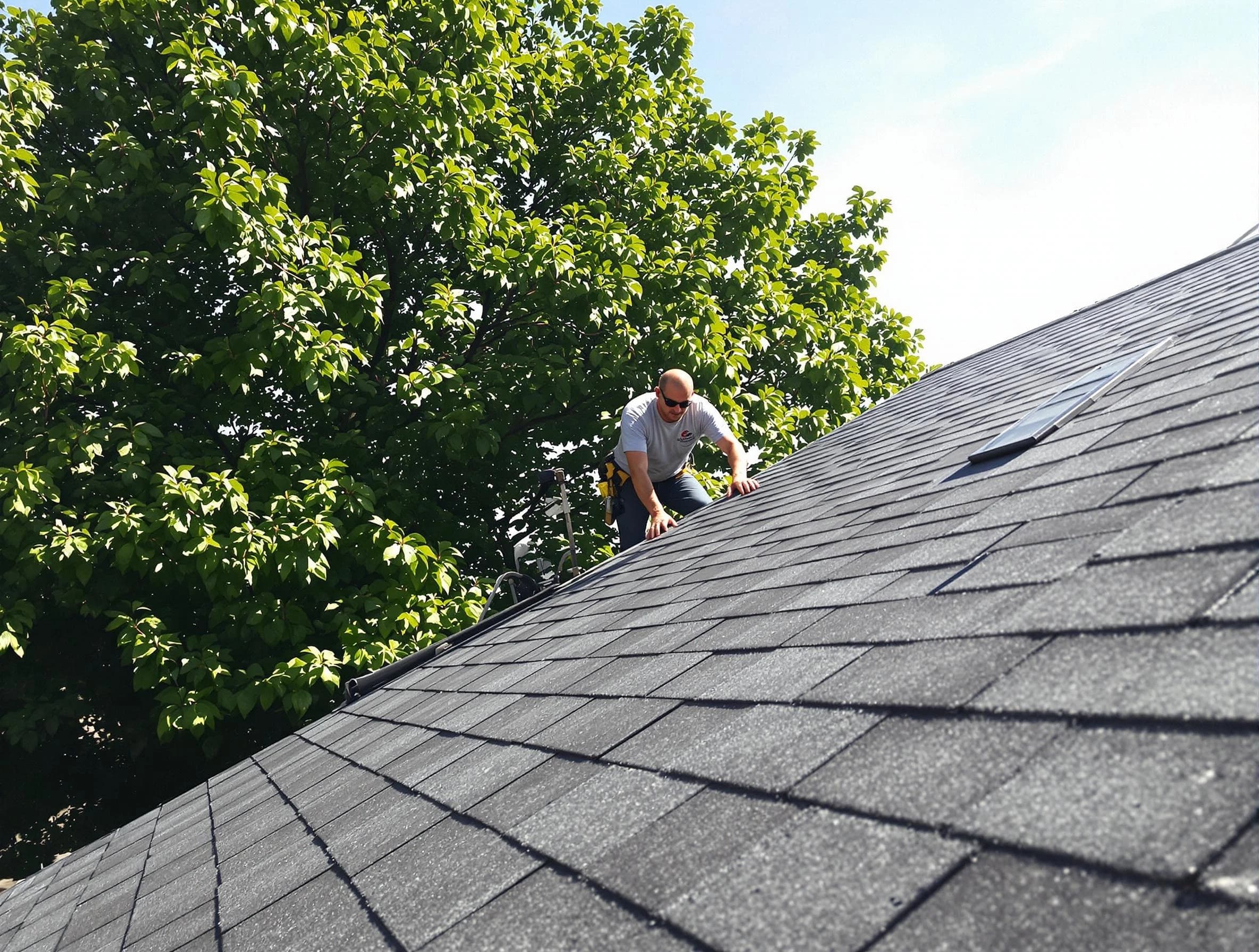 Certified roofers from Painesville Roofing Company working in Painesville, OH